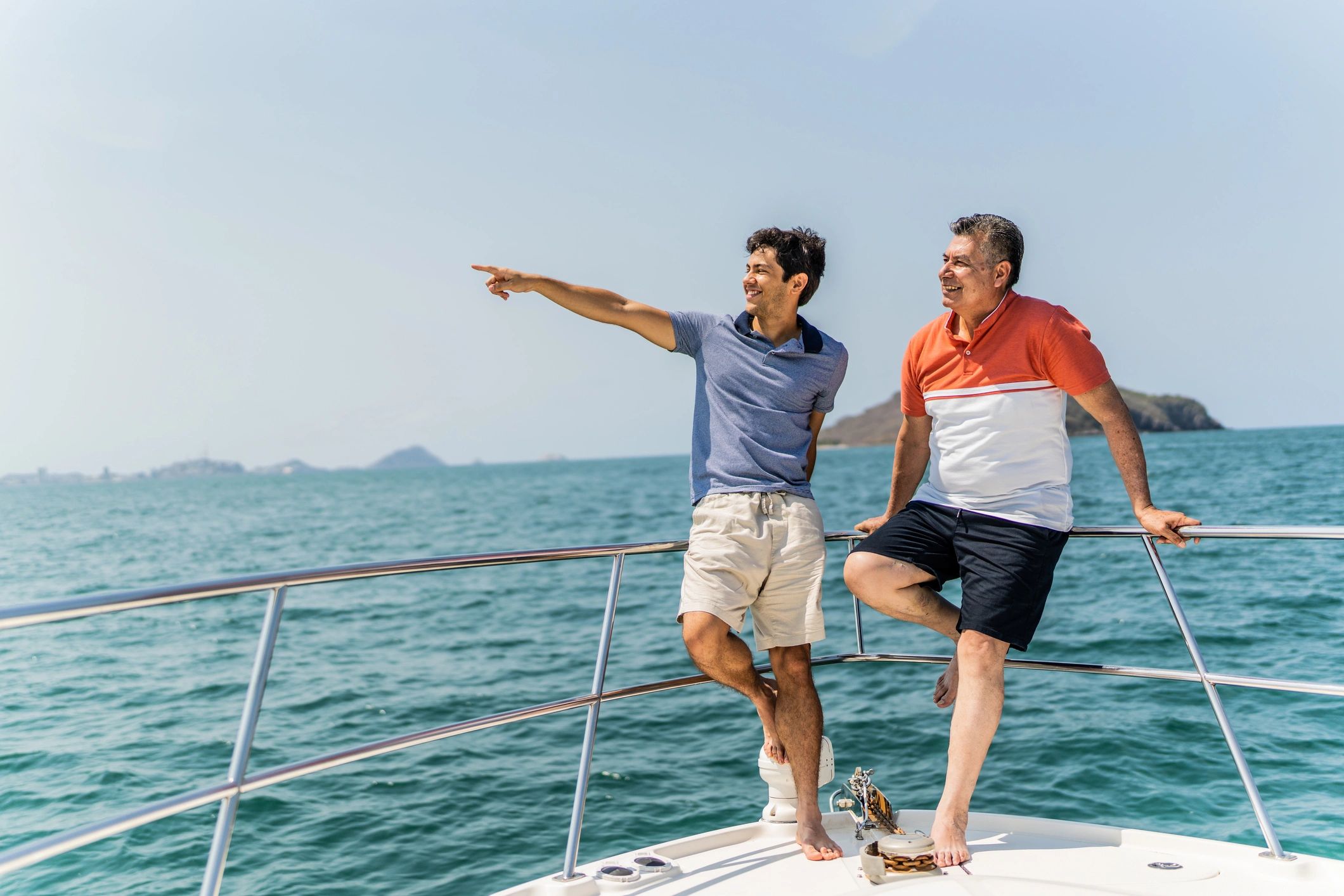 Two people talking on a boat deck