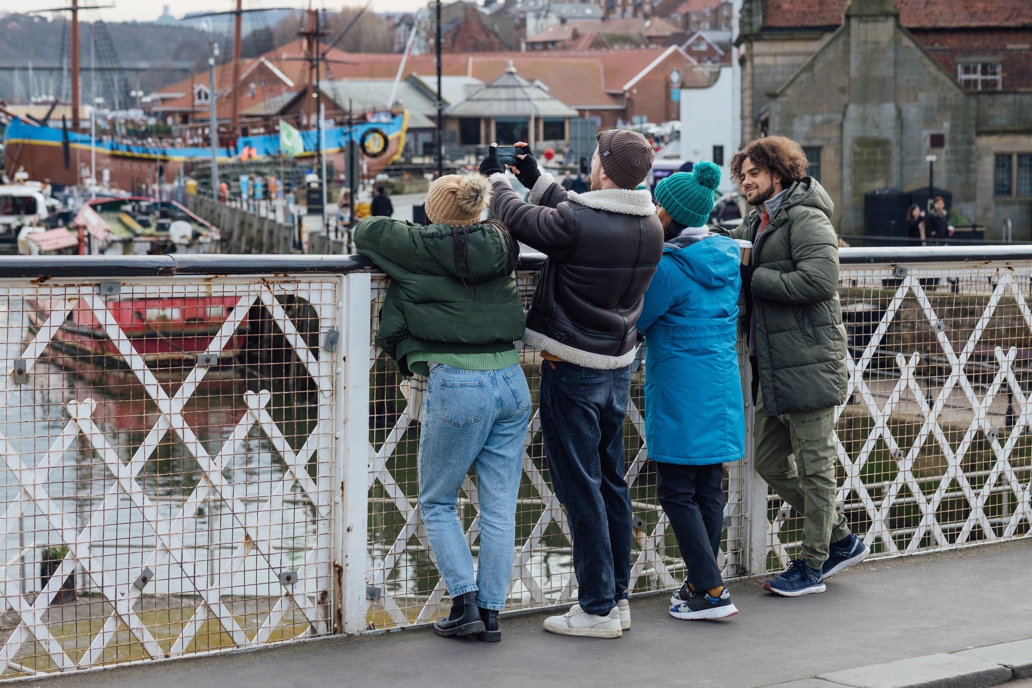 People photographing a harbor view