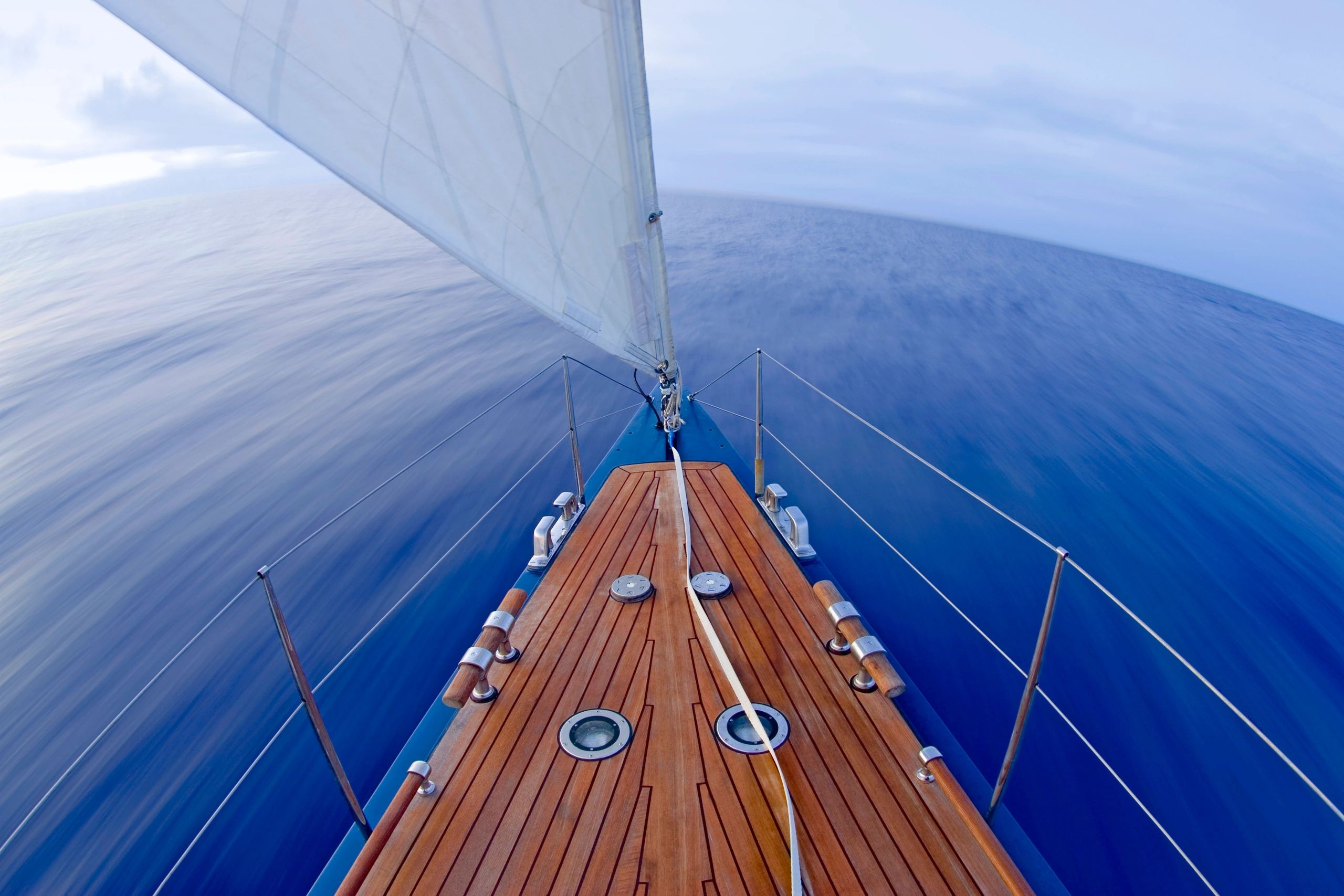 Bow of a sailing yacht cutting through the sea