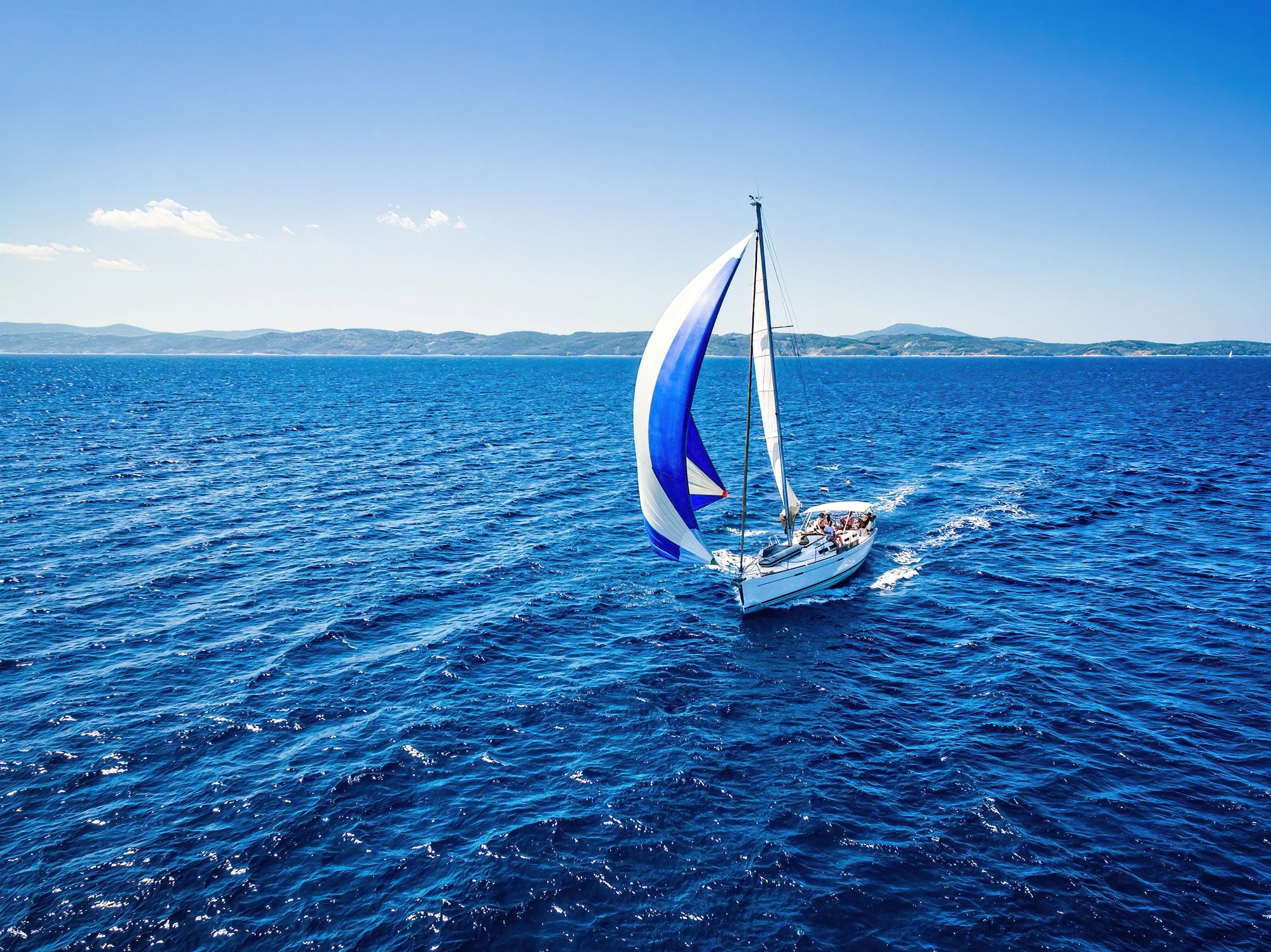 Drone view of a sailboat underway