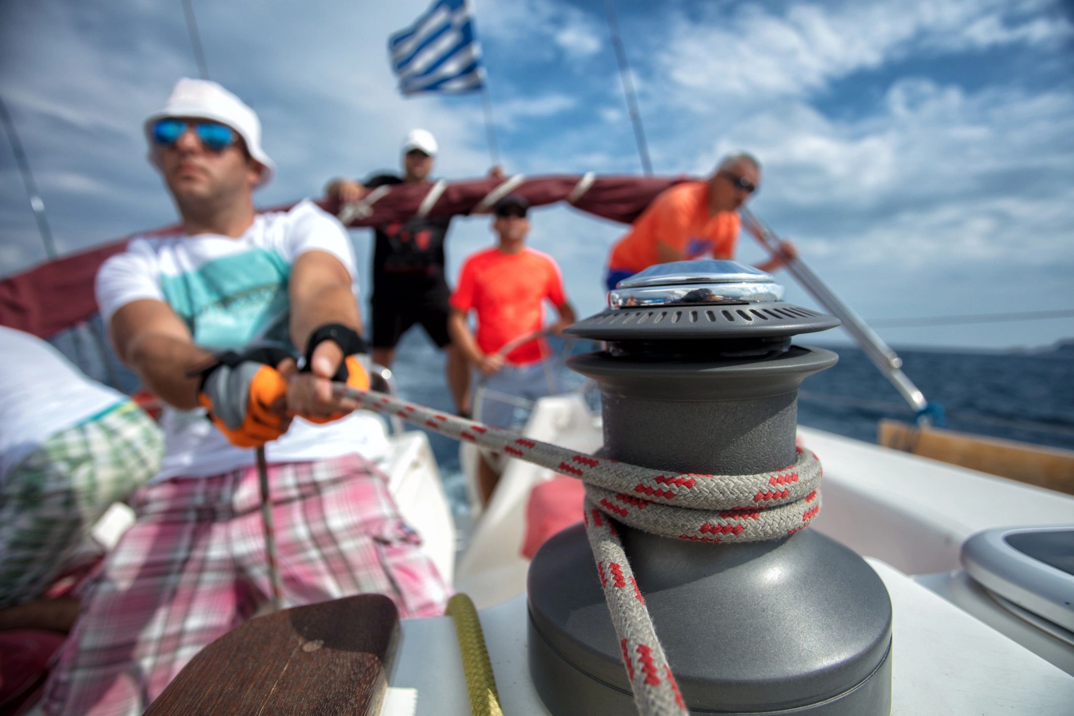 Sailing crew working as a team on deck